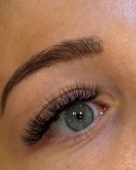 Soft eyelash extensions and shaped brow